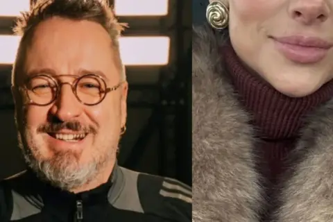 Piotr Kędzierski z żoną, ona w futrze i golfie, on w okularach i sportowej bluzie.