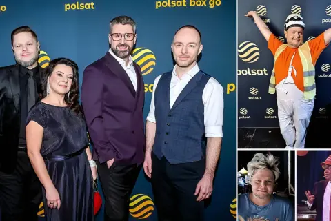 Grupa osób pozuje do zdjęć na tle niebieskiej ścianki z logo Polsat Box Go.