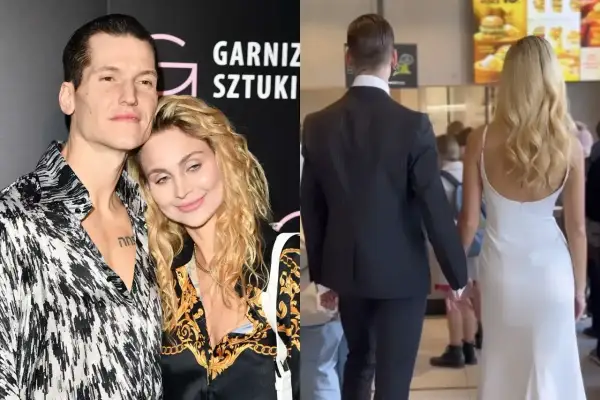 Jacek Jeschke z partnerką, w eleganckim stroju i sukni, trzymają się za ręce.